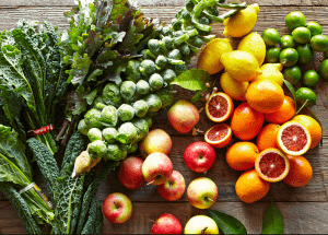 a group of fruits and vegetables on a wood surface Healthy Weight Loss Diets Market Mowbray